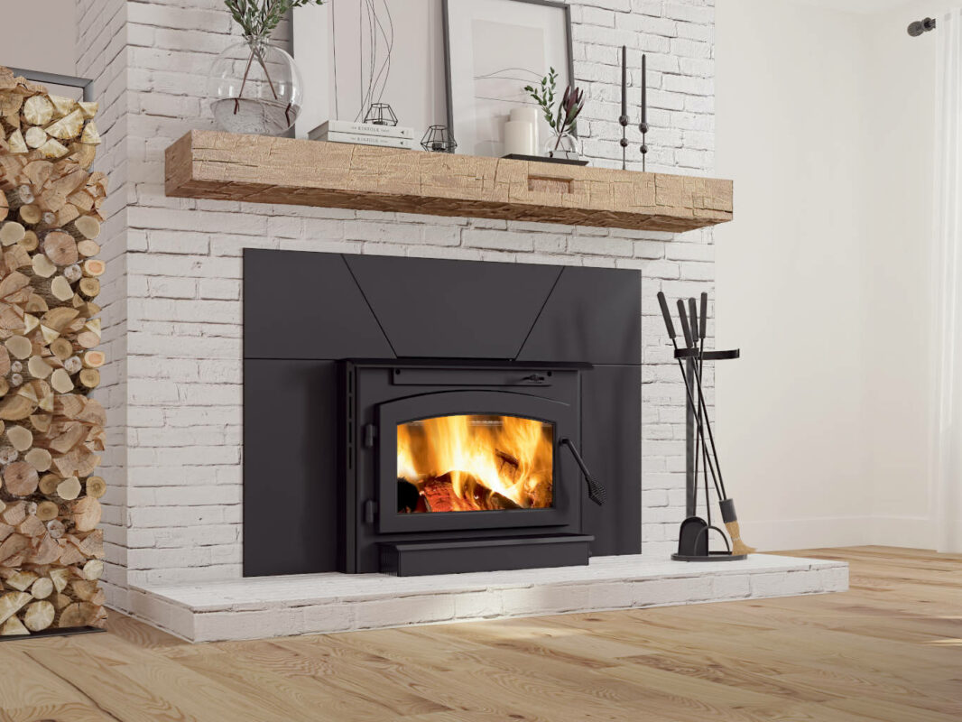 Outlander® 19i Wood Burning Fireplace Insert with a white brick surround.